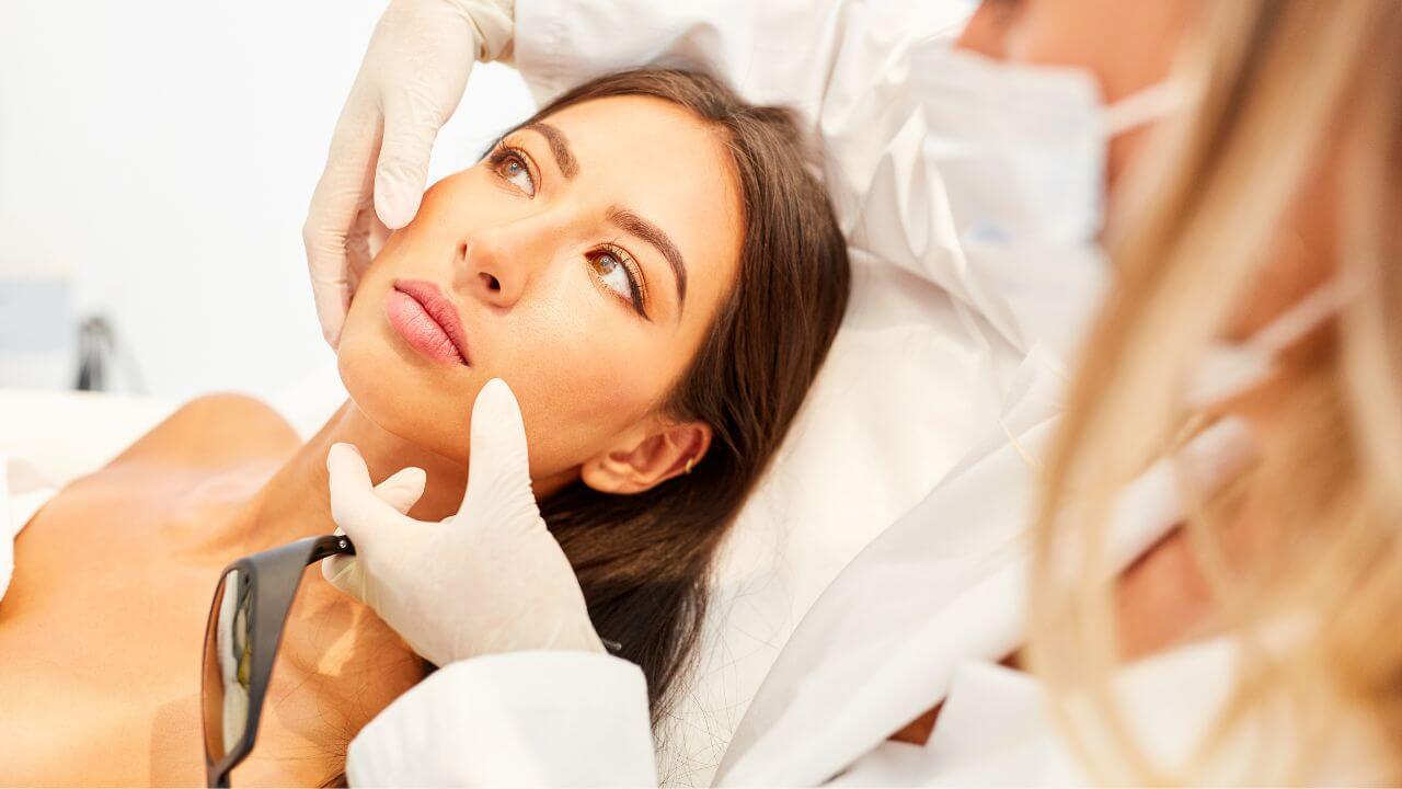 Young woman preparing to undergo laser treatments by a board-certified plastic surgeon to get rid of laugh lines.