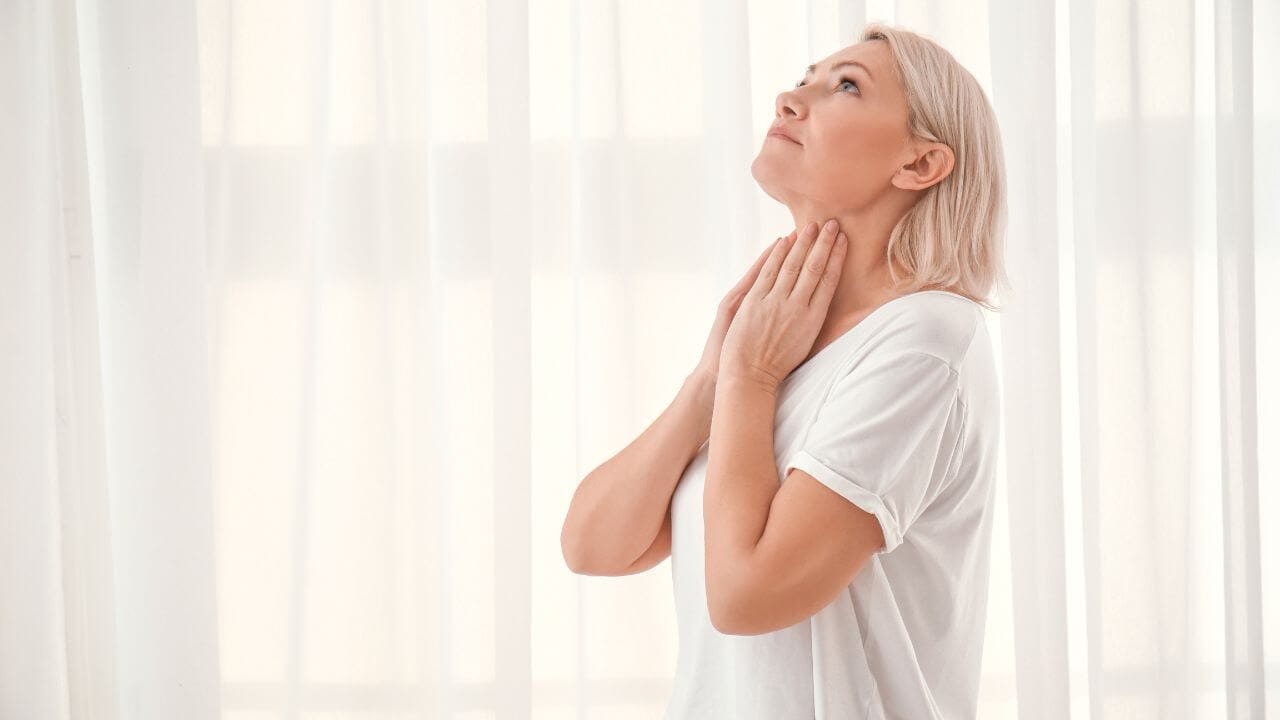 Woman covering her neck wrinkles